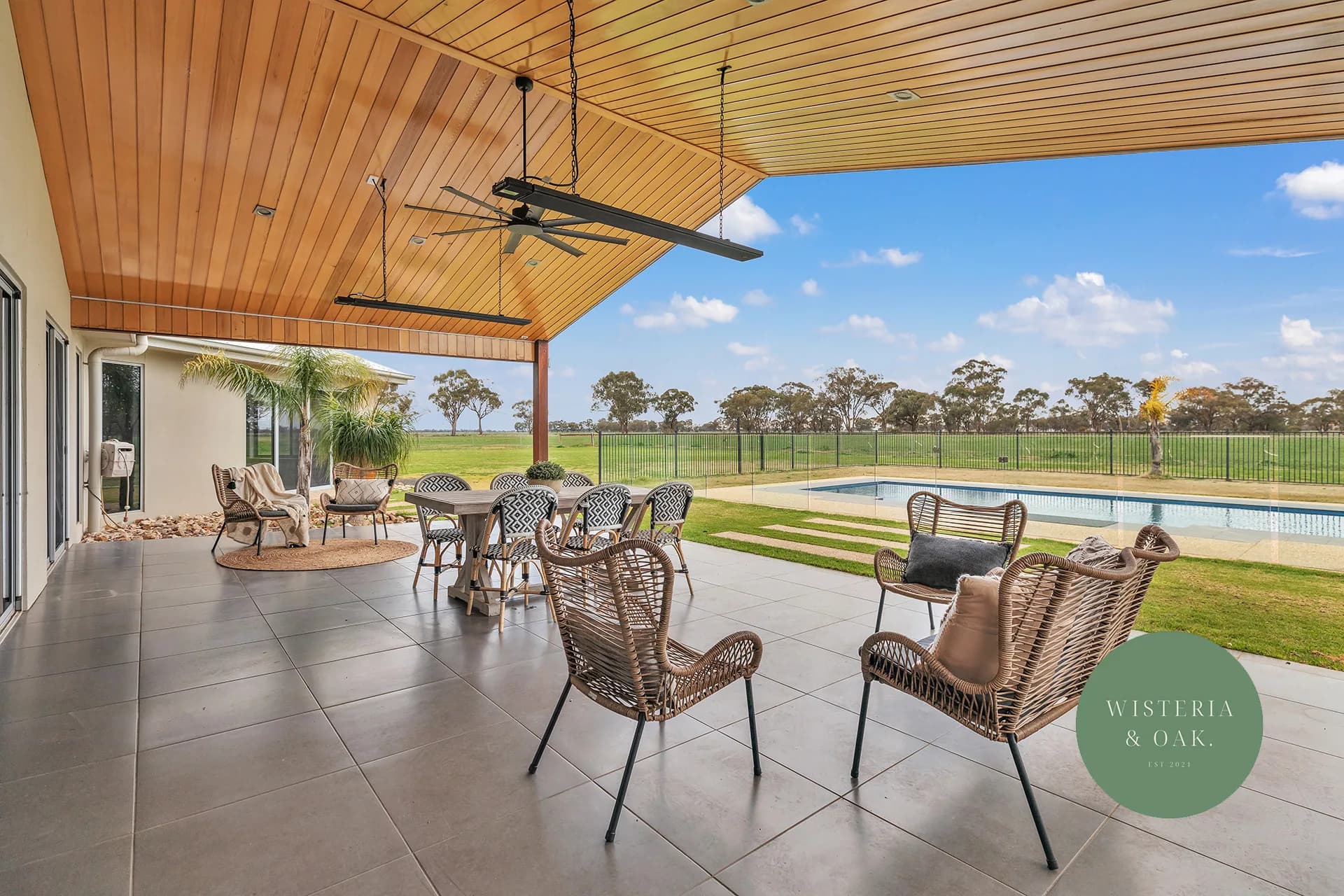 Covered alfresco with a timber lined ceiling looking over the pool and paddocks at Thyra Road, Moama